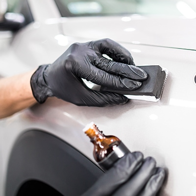 a man polishing a car