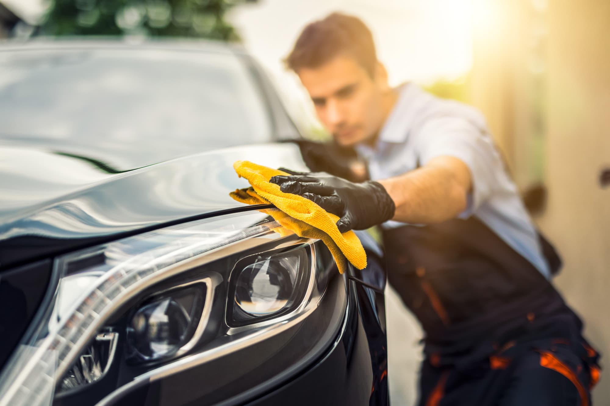 a man washing a car