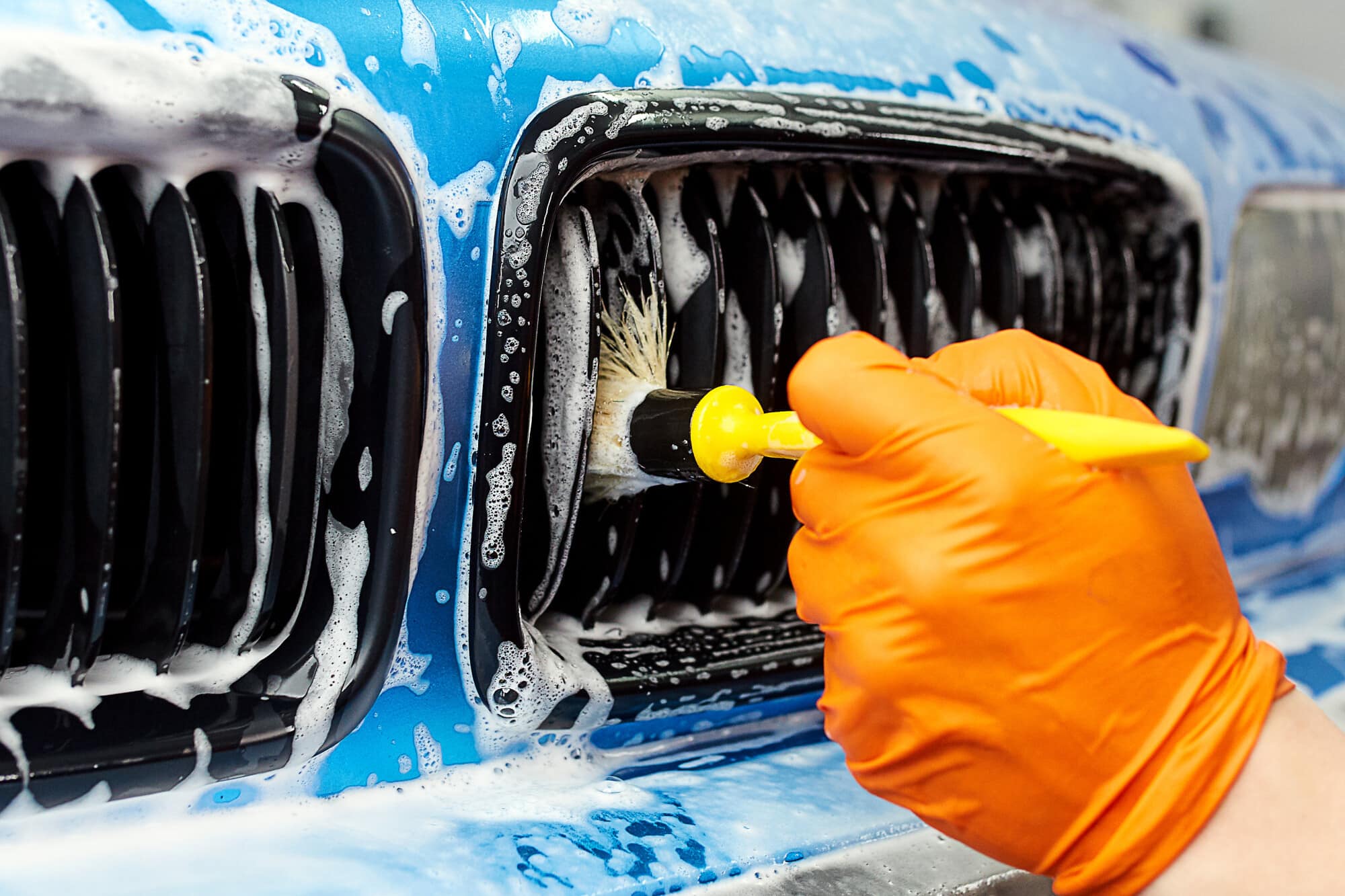 a man washing a car