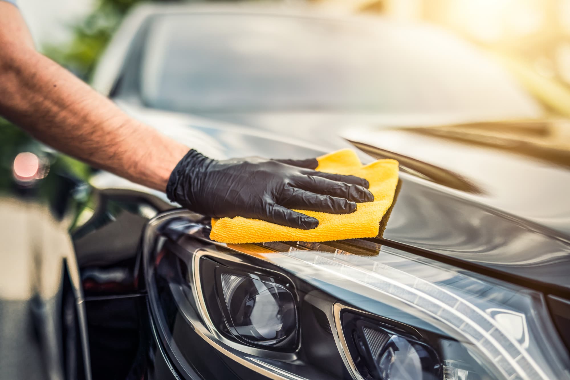 a man washing a car
