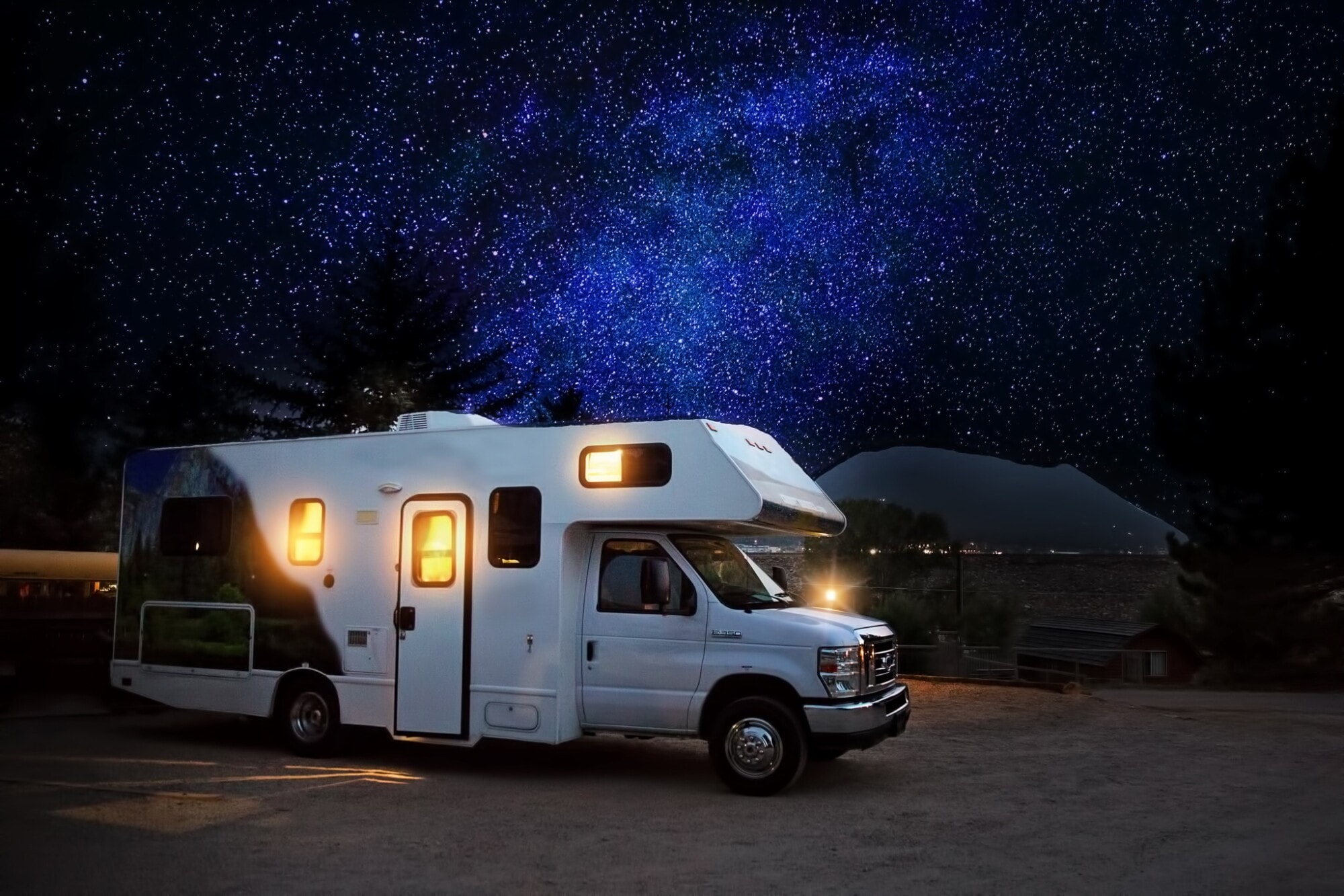 an rv parked at night