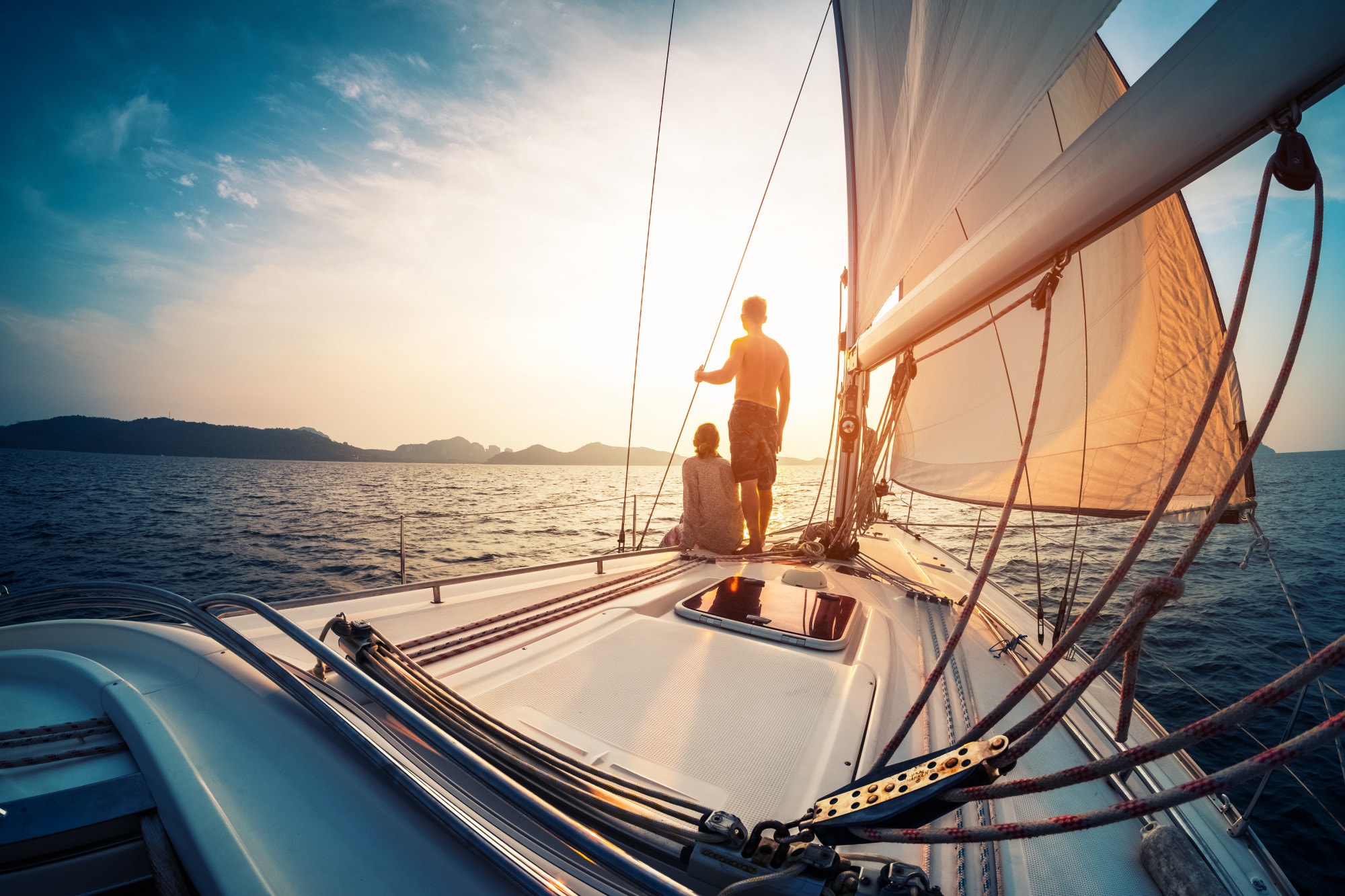a man and woman on a boat dock
