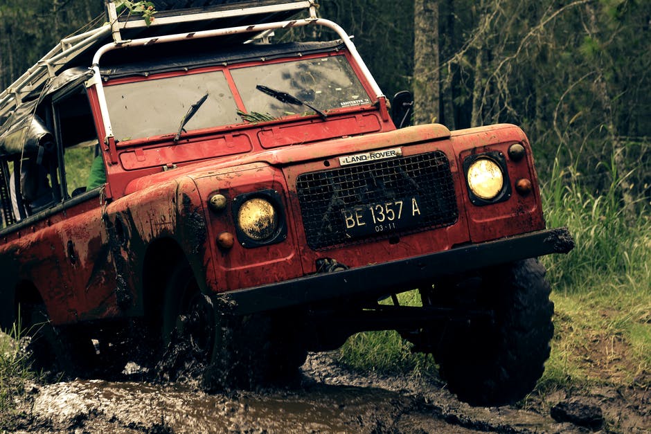 a land rover going through mud