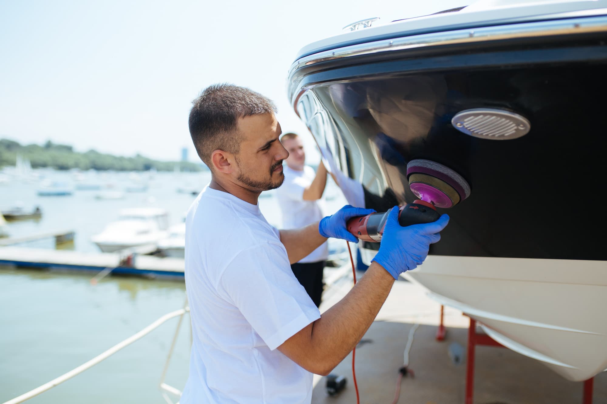a man polishing a boat