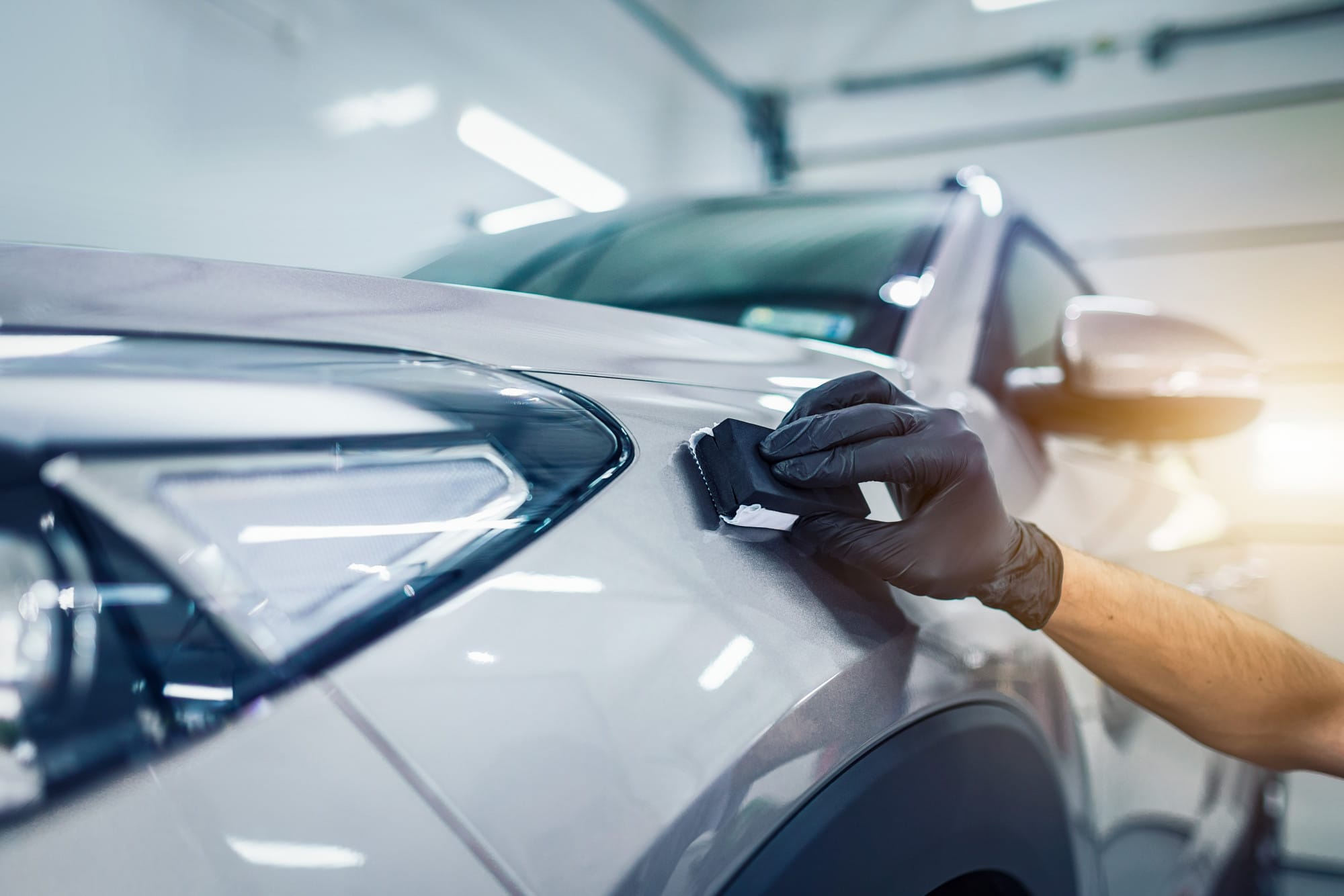 a man polishing a car