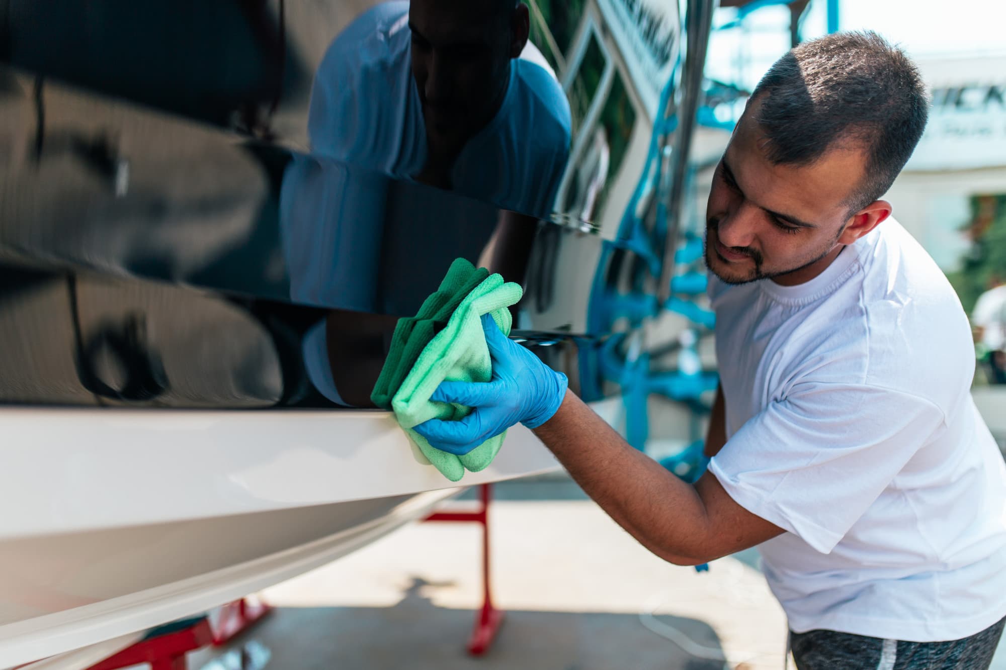 a man polishing a car