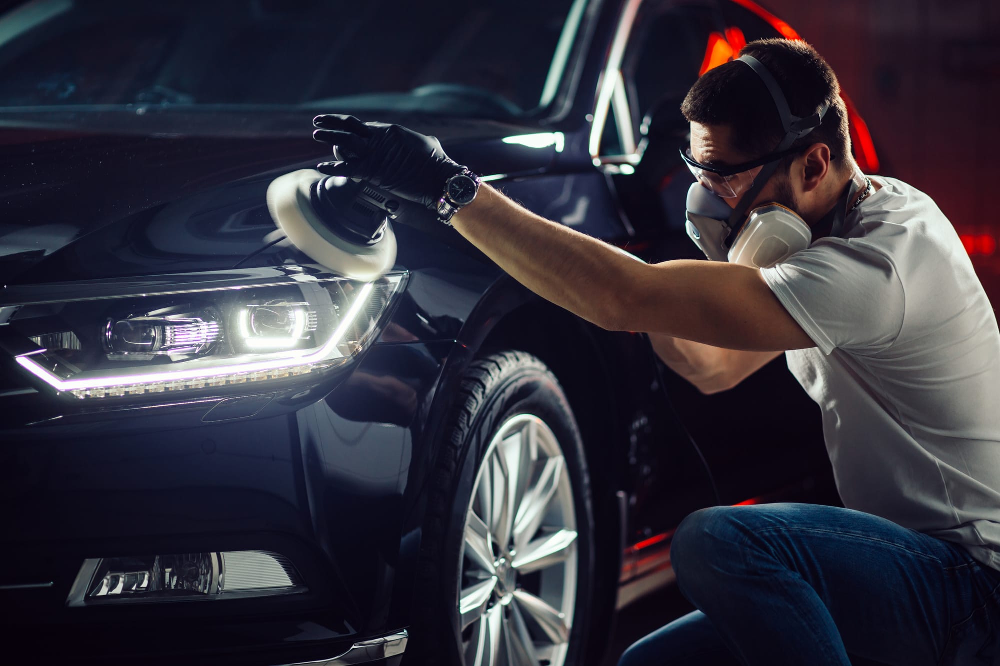 a man polishing a car