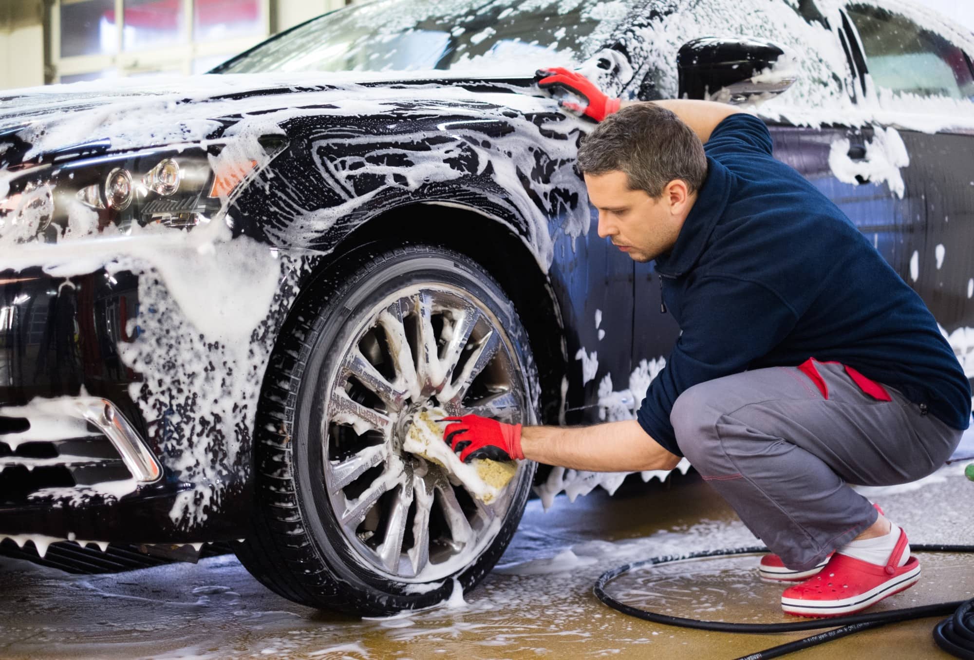 a man washing a car