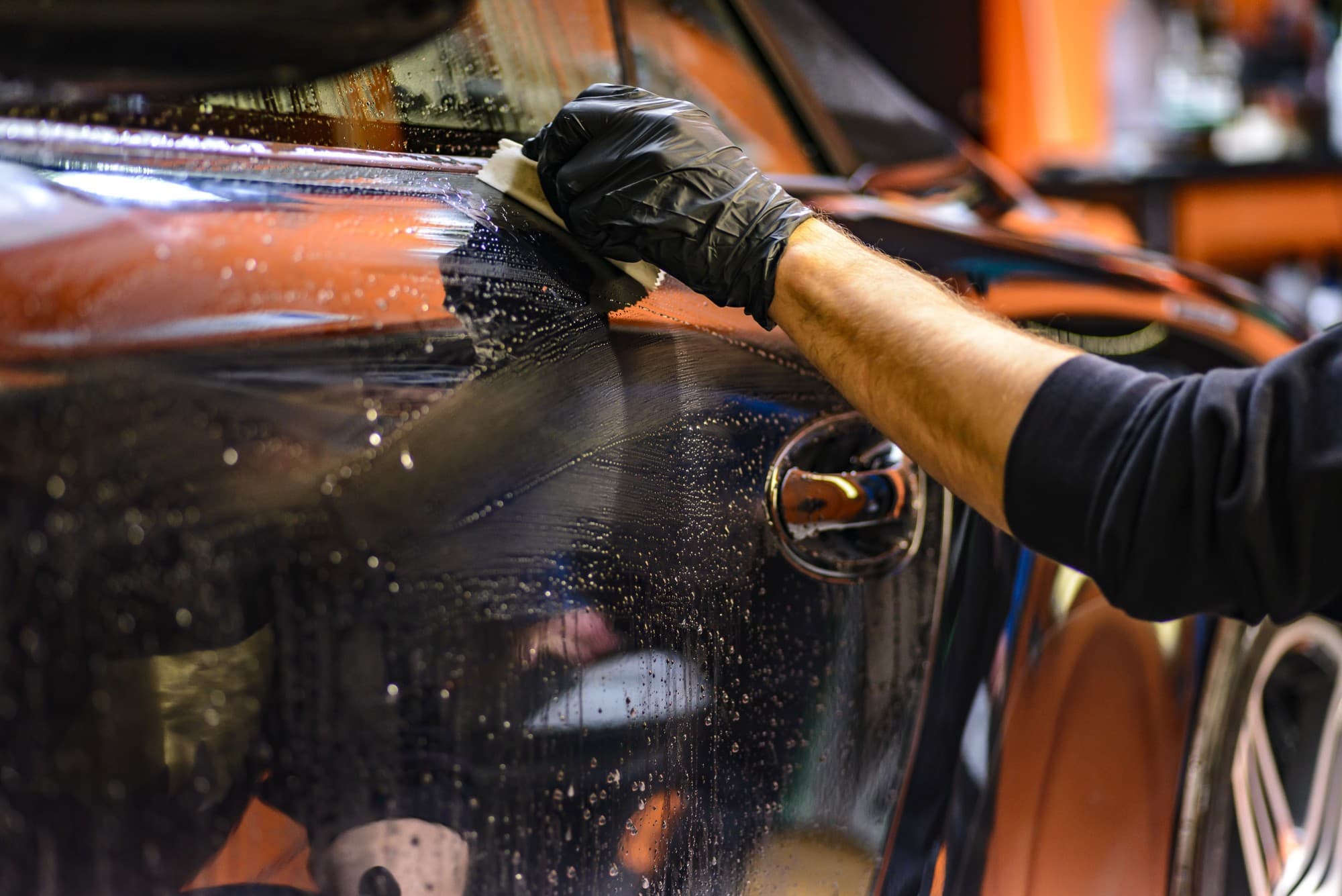 a man cleaning a car