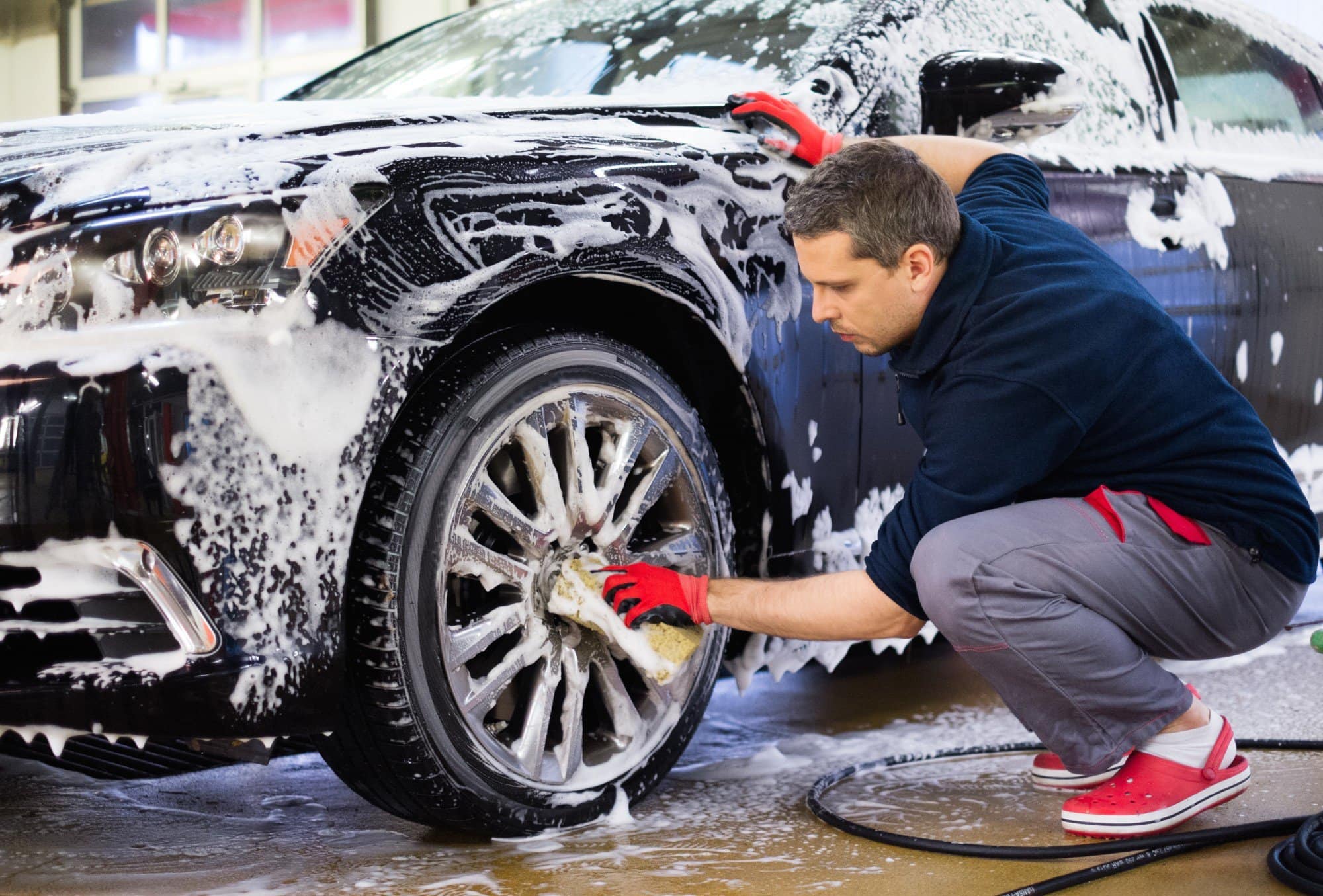 a man washing a car